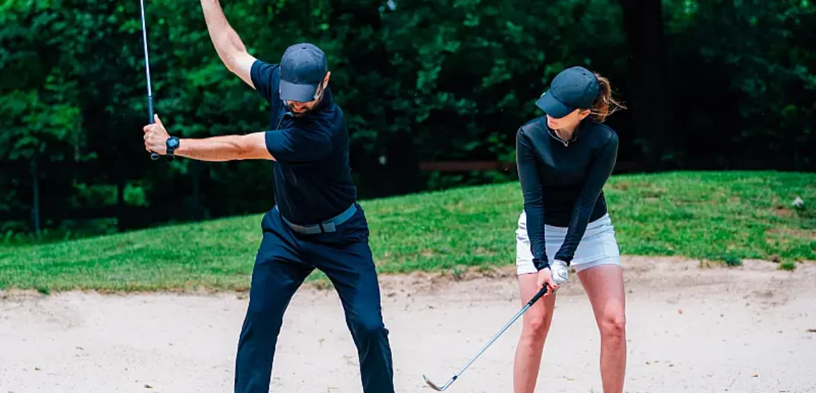 golf-sand-practice-shots-young-woman