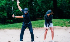 golf-sand-practice-shots-young-woman
