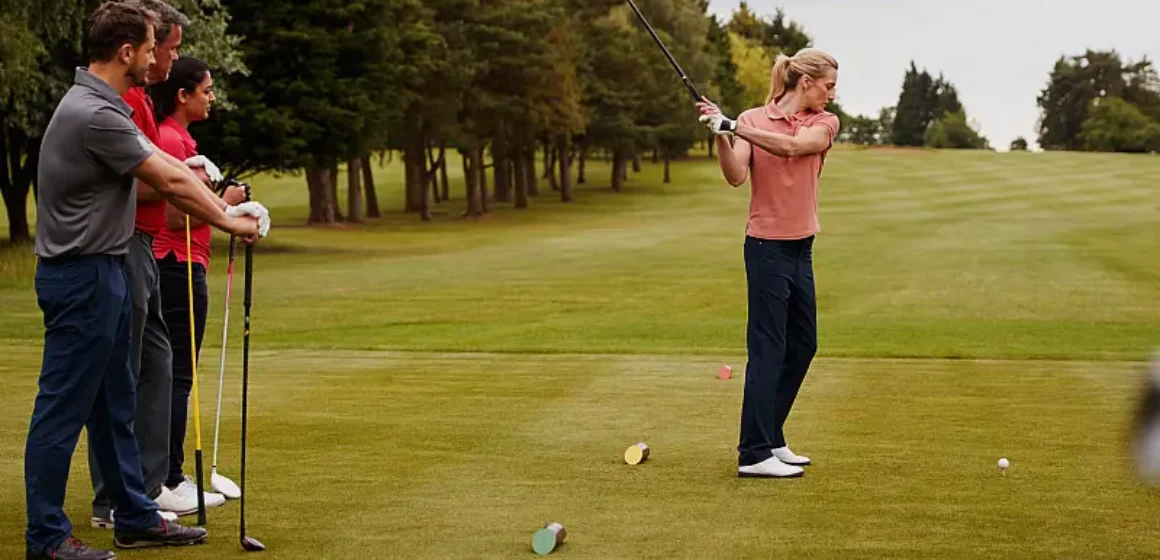 two-couples-golfing-hitting-tee-shot