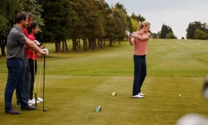 two-couples-golfing-hitting-tee-shot